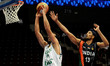 Iran's Hamed Sohrabnejad (L) goes up for the basket as India's Amjyot Singh trails behind...