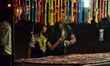 An Indian woman shops for 'rakhi' (sacred thread) at a market ahead of the Hindu festival...