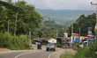 Road cutting through the small village of Gampola high in the mountains near the town Nuwa...