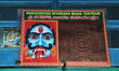 Portrait of a fearsome deity along side a NaraGhosha Yantra hanging above the entrance of...