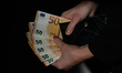 In this photo illustration a nitizen holds fifty Euro banknotes. On Wednesday, January 12...