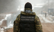 A member of the Polish Border Guards is seen at the construction site of the border wall w...