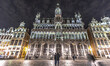 Panoramic night view with the illuminated historic picturesque buildings of Grand Place sq...