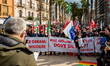 Protesters protest with placards in the square in front of the Municipality of Bari agains...
