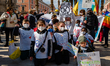 Protesters protest with placards in the square in front of the Municipality of Bari agains...
