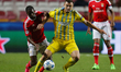 Benfica's defender Nelson Semedo (L) vies for the ball with Astana's forward Aleksey Shche...