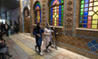 Three Iranian young women walk past a traditional restaurant in the holy city of Qom 145Km...