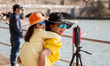 A mother and daughter take a selfie at the tidal basin in Washington, DC.  The cherry tree...