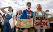 Protesters take part in a strike against climate change by the youth-led organization, Fri...