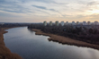 A drone view of Czerniakowskie Lake and residential neighbourhood in the background, in Wa...