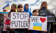 Protesters attend a rally at the White House for Ukraine.  Hundreds of people gathered to...