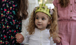 A Palestinian girl attends the Palm Sunday Mass at the Roman Catholic Church of the Holy F...