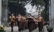 Scout members march during the 67th anniversary of the Asian African Conference on April 1...