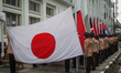 Scout members raise the flag of the Asian-African conference members on April 18, 2022, at...