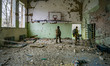 Ukrainian soldiers check the sport center of a school in  the village of Luch, a village c...