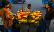 A fruit seller is seen selling salads during evening time ahead of iftar in Kolkata , Indi...