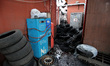 LVIV, UKRAINE - APRIL 18, 2022 - Car tyres are piled on the premises of an automobile repa...
