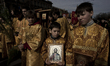 Orthodox christians believers takes part in a Palm Sunday procession, in St Petersburg, Ru...