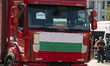 Buses and cargo vehicles parked in front of the Council of Ministers of the Republic of Bu...