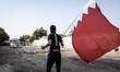 anti-government protester raising Bahrain flag and taking a part in Tamarod , Bahrain Tama...