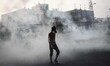 anti-government protester in middle of toxic gas clouds , Bahrain Tamarod also known as Au...