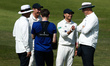 Umpire’s James Middlebrook and Alex Wharf interacts with Kiran Carlson of Glamorgan during...