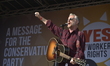 Singer, musician, writer and political activist Billy Bragg performing at the pre-demonstr...