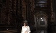 A woman walks along the main corridor of the San Francisco church. Porto, May 05, 2022. It...
