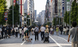 People walk and enjoy on a pedestrian mall at Ginza in Tokyo, Japan on 29 May. 