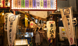 People walk along a path lined with Japanese bars at Shinbashi, Tokyo, Japan on 29 May. 