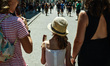 Tourists are eating ice cream walking thourgh the Old Town in Krakow, Poland on June 126,...