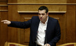 Greek PM Alexis Tsipras delivers a speech during the discussion at the Greek Parliaments p...
