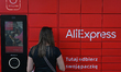 A woman picks up the package from the AliExpress machine in Rzeszow center.On Tuesday, Ju...