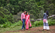 Indian tourists pose for a photo by Mannavanur Lake in the Mannavanur Village, Tamil Nadu,...