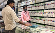 Man looks at dhotis at a textile shop in Thiruvananthapuram, Kerala, India, on May 10, 202...