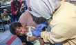 
A crying baby is immunized by a medical officer, during the BIAS (National Child Immuniz...