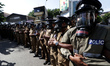 Sri Lankan police officers are seen  during a protest against state suppression demanding...