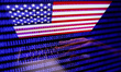 Flag of the United States displayed on a laptop screen and binary code displayed on a scre...