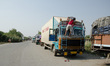 A truck driver cleans his vehicle at the India-Nepal border crossing in Sunauli on Novembe...