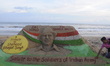 A sand sculpture of Saheed Bhagat Singh is seen at the Bay of Bengal Sea's Puri beach on h...