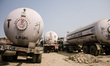 Trucks carrying liquefied petroleum gas wait at the closed border between India and Nepal...