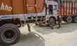 A truck driver sets out to prepare a meal on a camping stove in front of his vehicle at th...