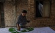 A worker making batik cloth pattern with a wax-resist cloth dyeing technique as make tradi...
