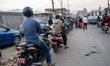 A motorcyclist stands in line at a fuel distribution point in Kathmandu on November 6, 201...