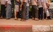 People are queuing on Insein road, in Yangon, in front of the polling station. They someti...