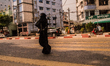 A Muslim woman is crossing the street to go to the polling station, in Hlaing township, Ya...