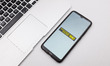 In this photo illustration a Western Union logo seen displayed on a smartphone screen on a...