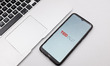 In this photo illustration a TED Ideas Worth Spreading logo seen displayed on a smartphone...