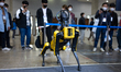 Visitors look the Spot of Boston Dynamics, known for its four-legged robot 'dog' in '2022...