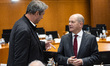 German Chancellor Olaf Scholz (R) greets Prime Minister of Bavaria Markus Soeder (L) prior...